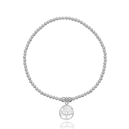 Silver beaded bracelet with a tree of life charm on a white background