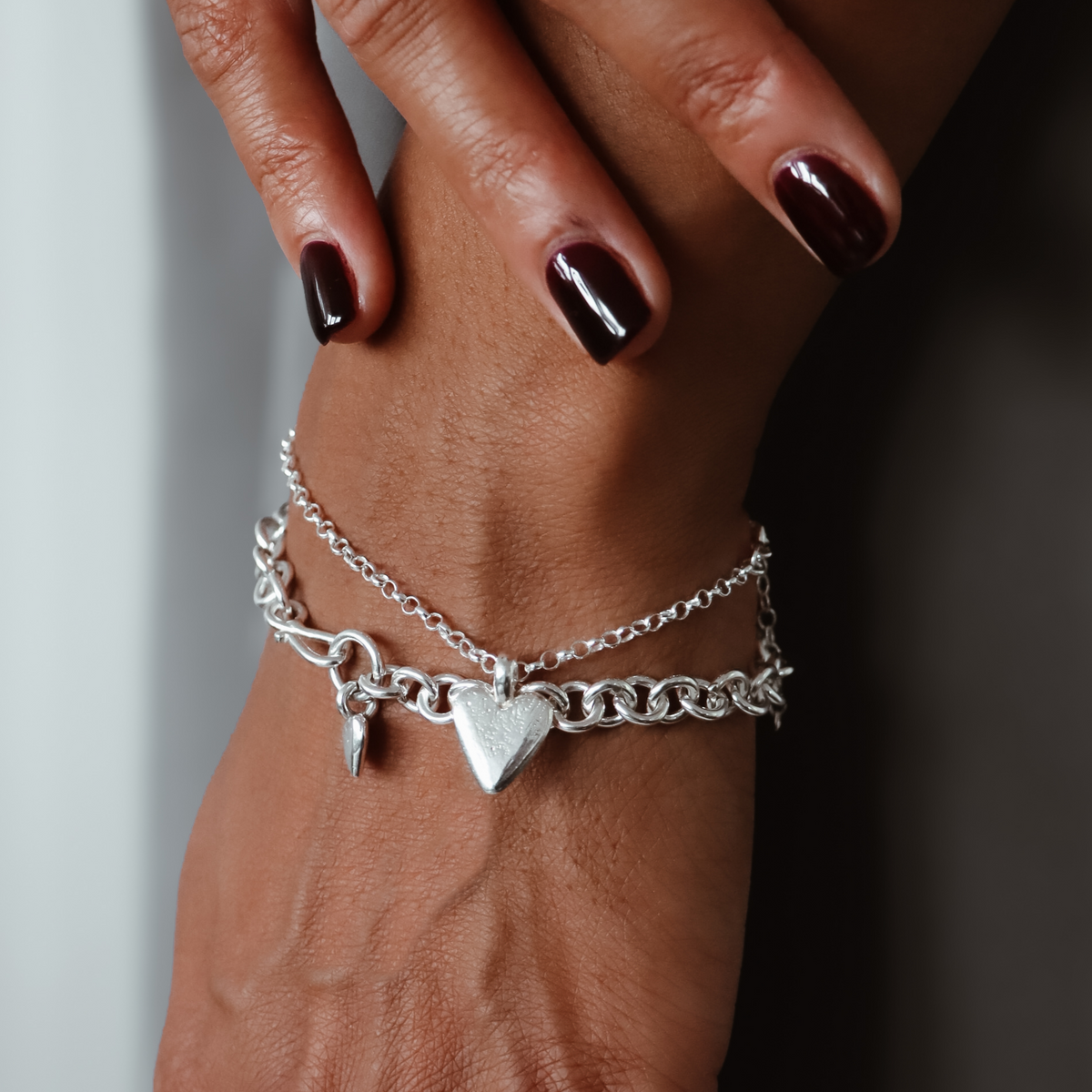True Love sterling silver heart bracelet worn on a wrist.