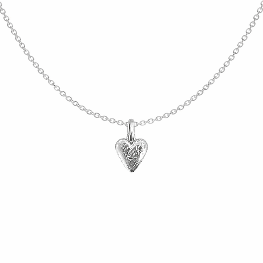 Silver heart-shaped pendant necklace on a white background